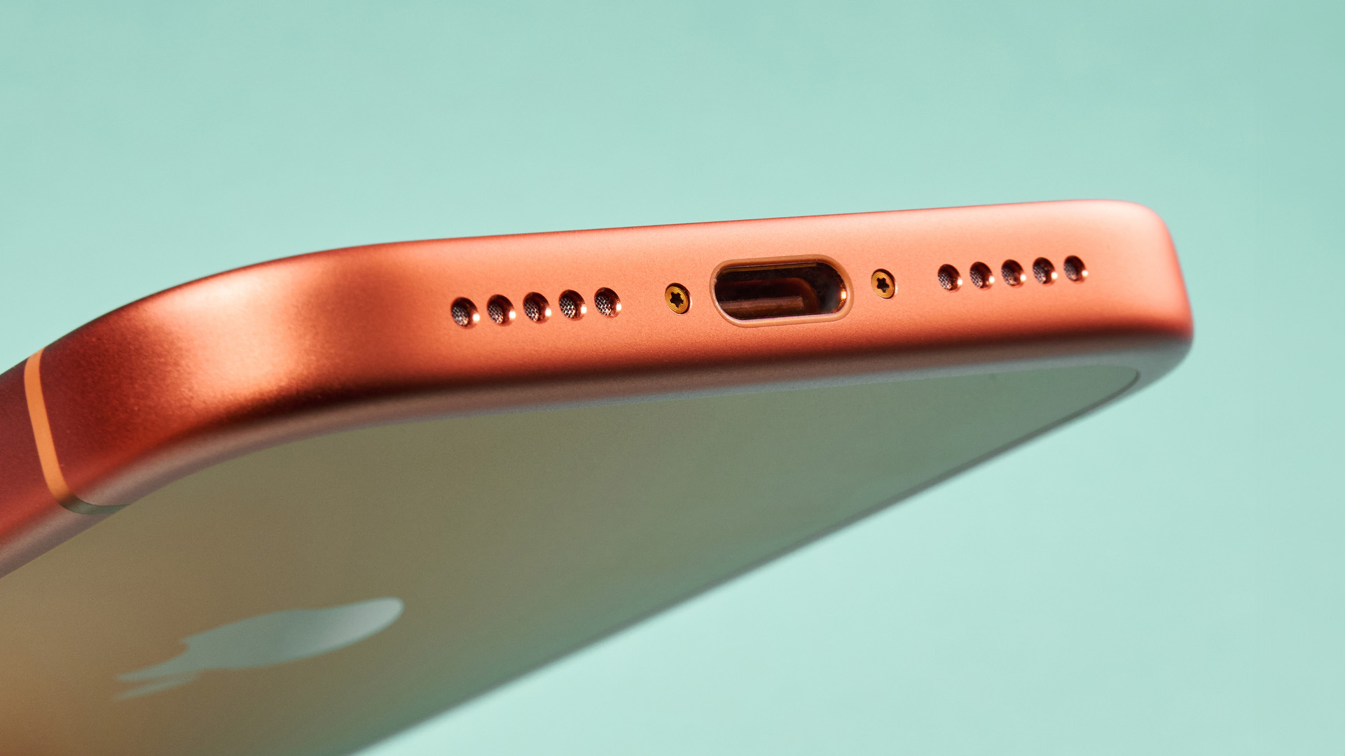 Apple iPhone 17 Pro in cosmic orange on green background