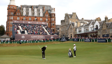 Rory McIlroy plays a chip shot into the 18th hole at St Andrews