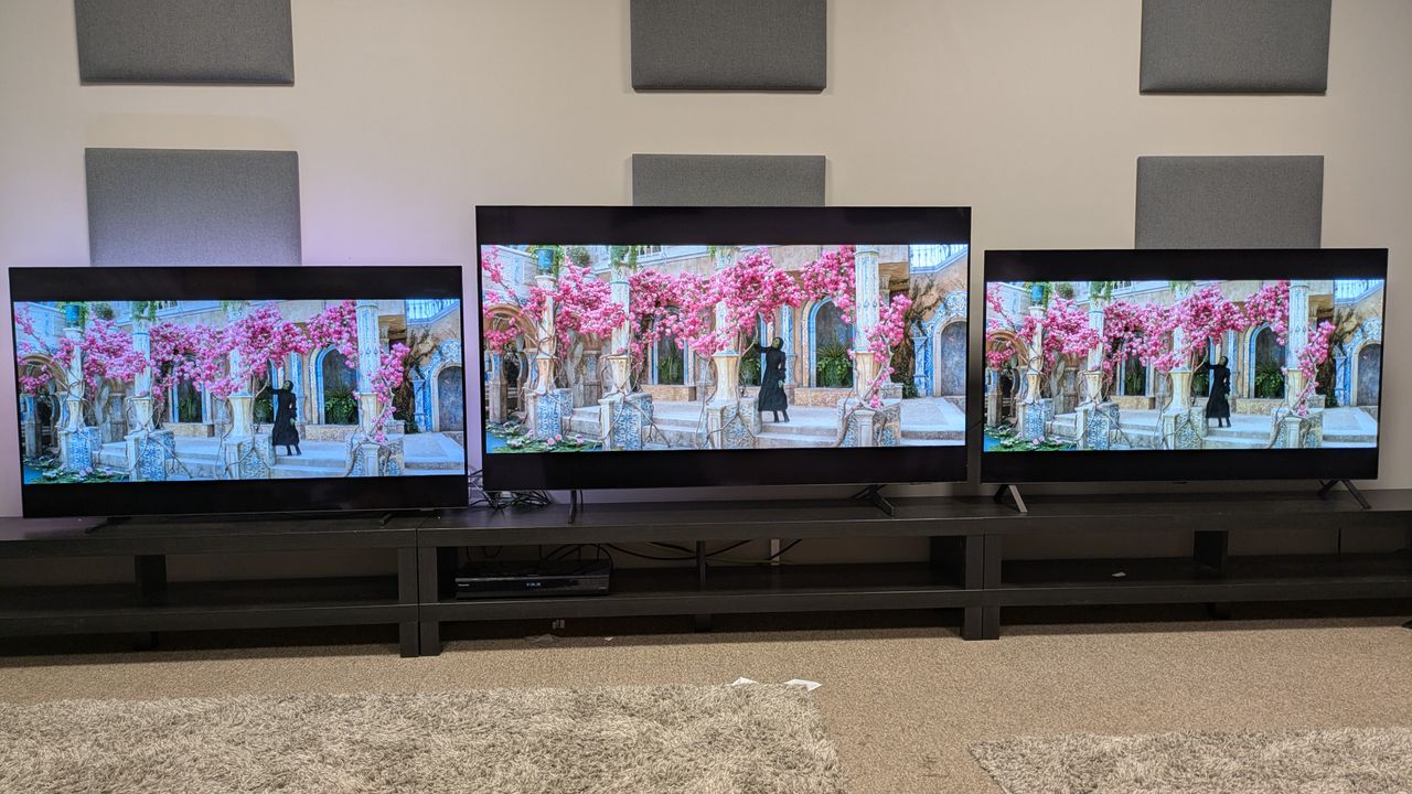 Philips OLED760 vs Samsung S85F vs LG B5 showing Elphaba under a pink tree from Wicked on screen