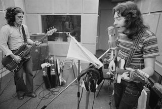 Irish singer and guitarist Rory Gallagher (1948-1995) plays an electric guitar with bass guitarist Gerry McAvoy (on left) in a recording studio on 23rd July 1973.