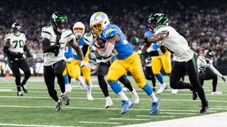 Austin Ekeler #30 of the Los Angeles Chargers runs with the ball during the first half against the New York Jets at MetLife Stadium on November 06, 2023