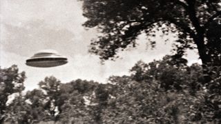Black and white image of a flying saucer