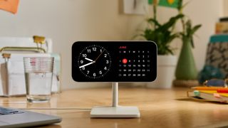 iOS 17 StandBy Mode screen showing clock and calendar