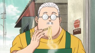 Mr. Sakamoto eating noodles outside of his store