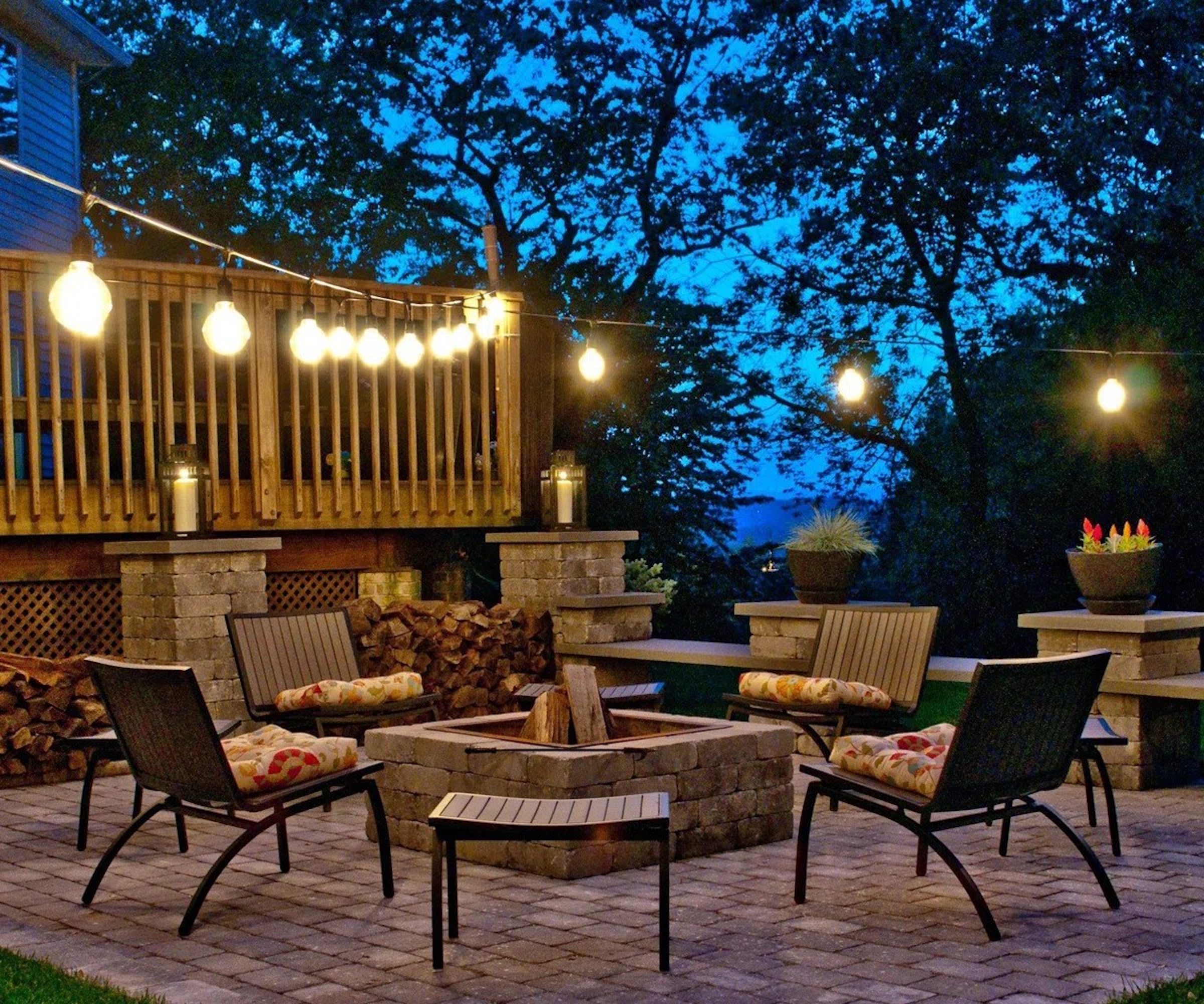 Festoon lights hanging over a patio during summer