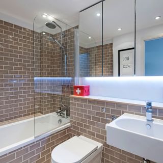 bathroom with brickwall and white interiors