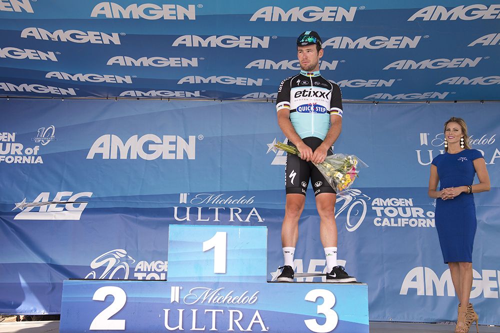 Mark Cavendish waits for the names of Wouter Wippert (2nd) and Peter Sagan to be called onto the podium