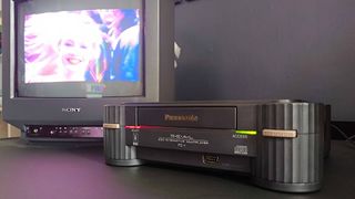 Panasonic 3DO plugged into Sony Trinitron CRT TV with Road Rash cutscene on screen.