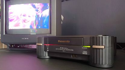 Panasonic 3DO plugged into Sony Trinitron CRT TV with Road Rash cutscene on screen.