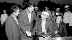 Jack Burke, Jr. (1956 Champion), Horton Smith, Clifford Roberts and Bobby Jones chat during the Presentation Ceremony at the 1956 Masters 