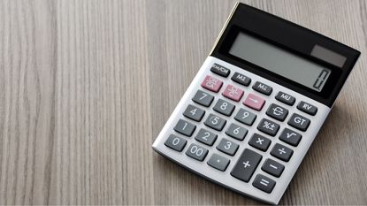 A calculator sits on a table.