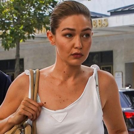 Gigi Hadid wore a white tank top from Prada with culottes and the Mary Janes shoe trend
