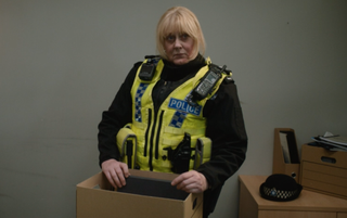 Catherine Cawood packing up her things at the police station