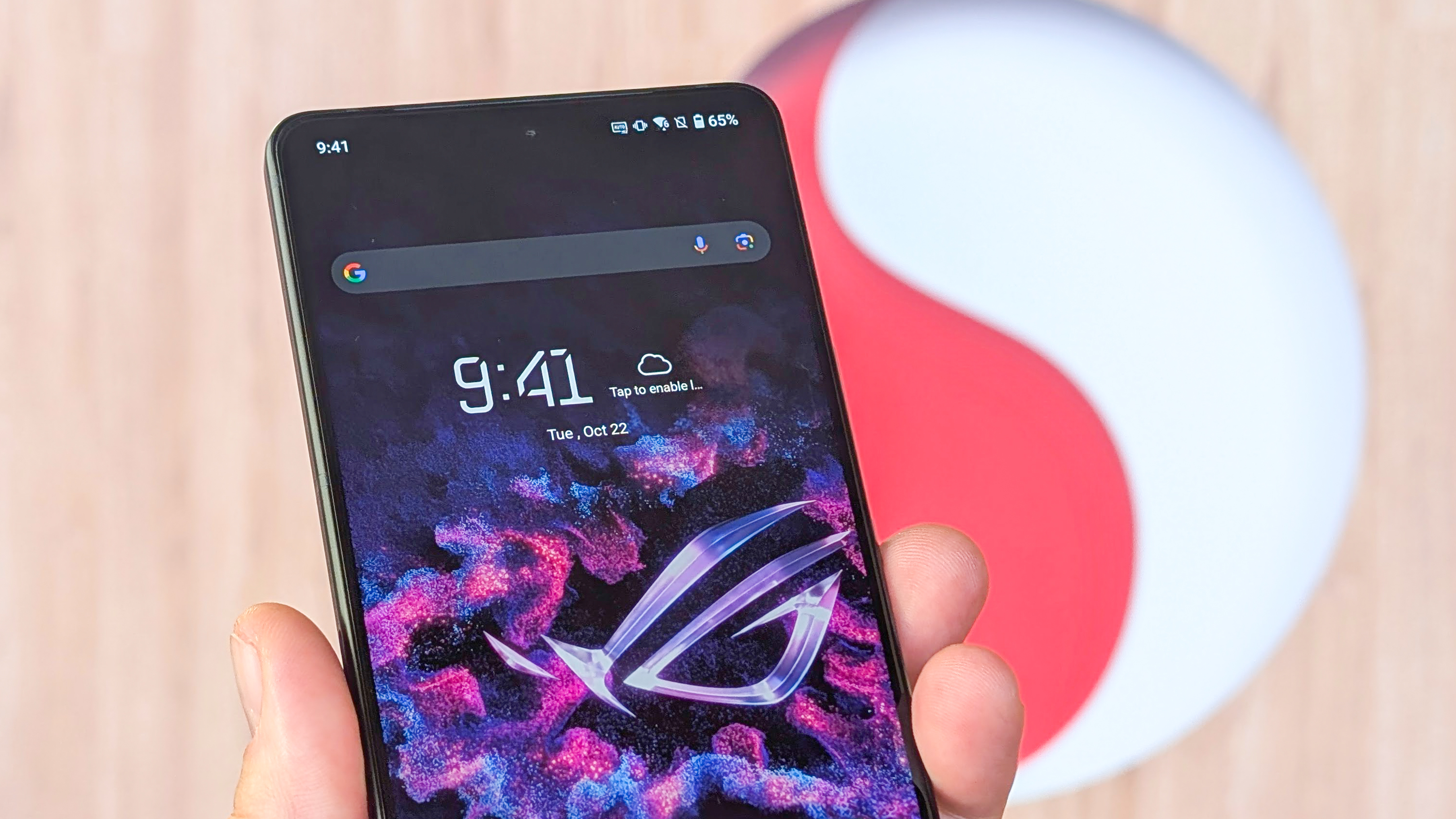 Asus ROG Phone 9 front and back and sides view with Snapdragon logo behind