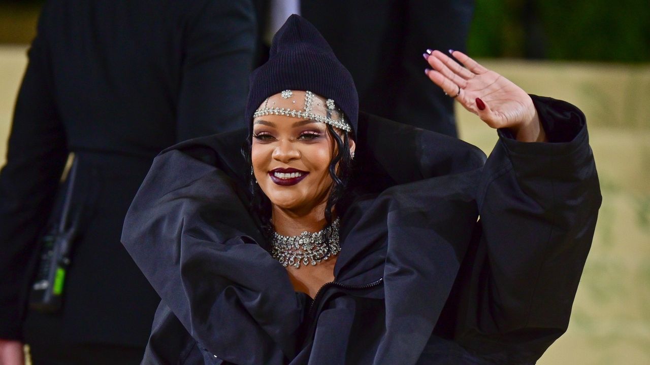 Rihanna waving and smiling