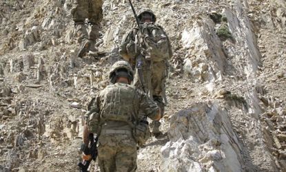U.S. soldiers ascend a rocky terrain during a foot patrol on June 27 in Pech Valley, Afghanistan.
