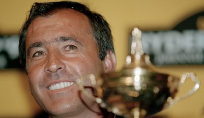 Seve Ballesteros smiles with the Ryder Cup in front of him