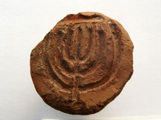 an engraving of the menorah that was likely used as a baker's stamp in ancient Israel