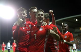 Ben Woodburn, left, scored the only goal as Wales won without Gareth Bale