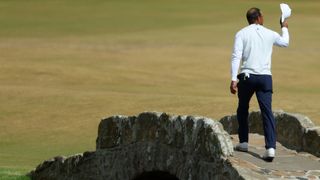 Tiger Woods waves to the crowd on the Swilcan Bridge during the second round of the2022 Open