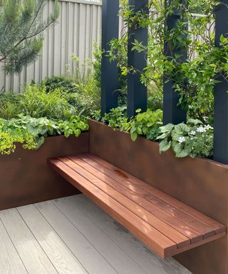 built in wooden bench in a garden