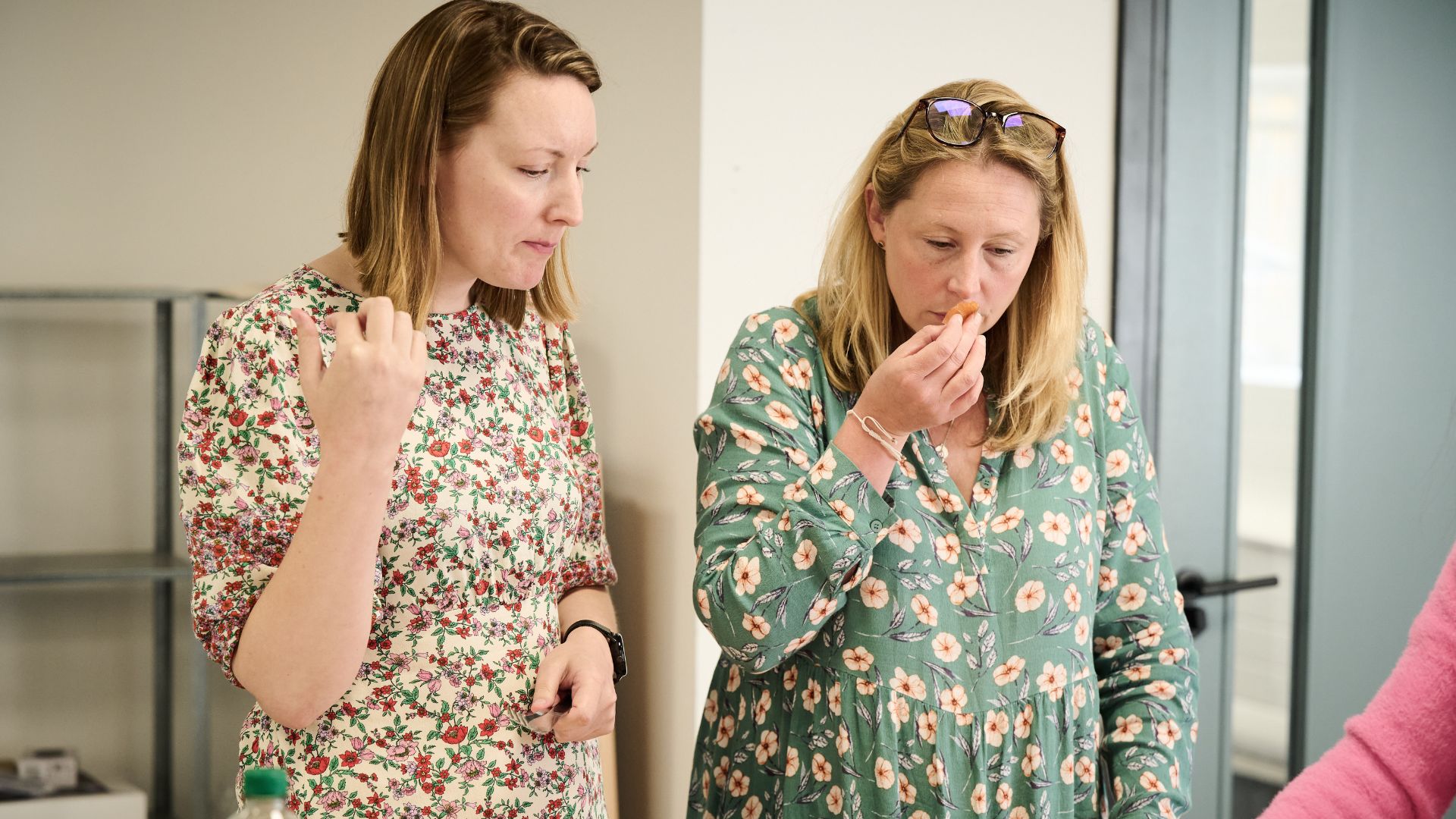 two members of the woman&home food testing team deliberating and tasting the best smoked salmon contestants