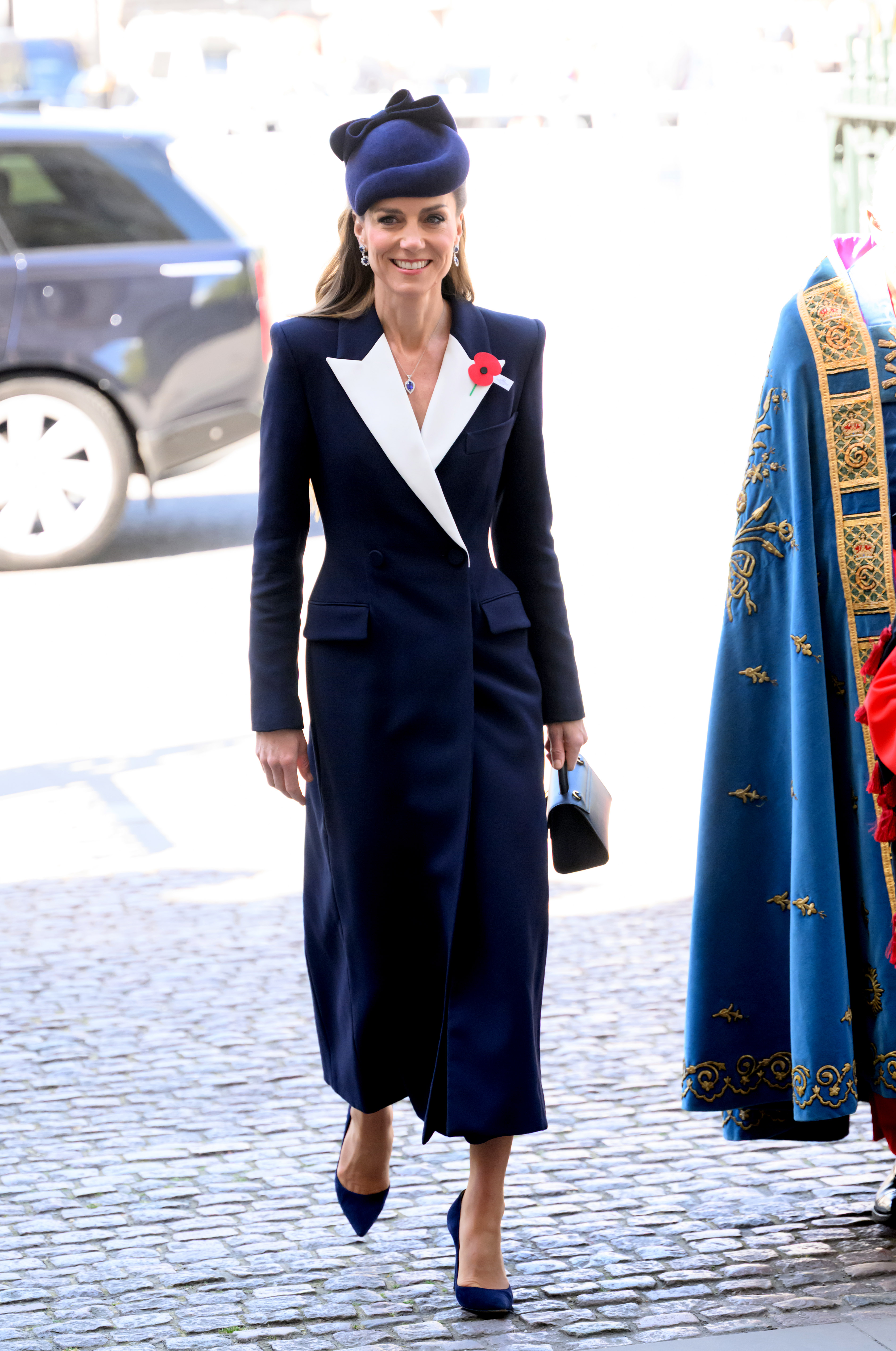 Kate Middleton wearing a coat dress from ALEXANDER MCQUEEN with jewelry from Prince William and Princess Diana