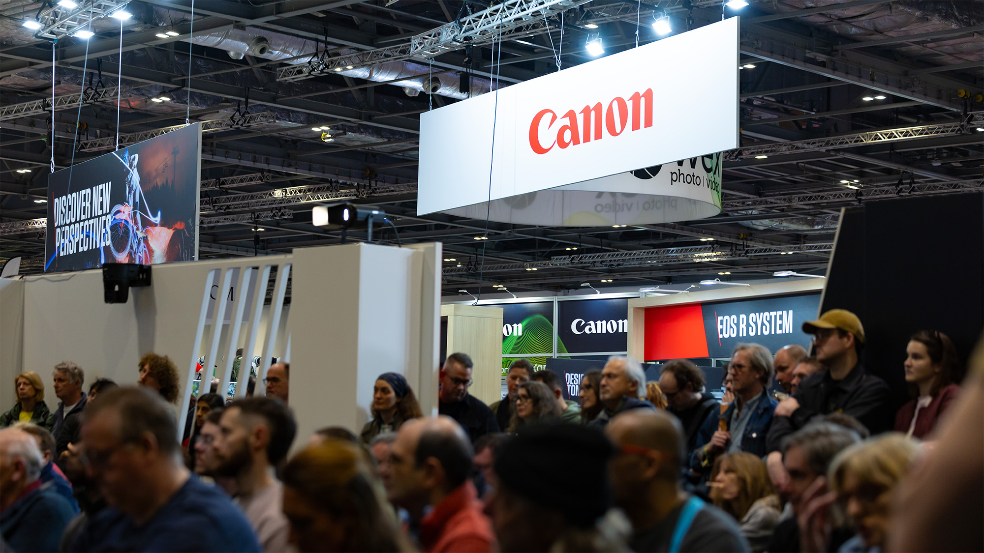 Photograph of the Canon stand at The Photography &amp; Video Show with a bustling crowd in the foreground 
