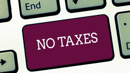 picture of computer keyboard button with "no taxes" written on it