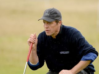 Hugh Grant playing golf in October 2014. Credit: Ross Kinnaird (Getty Images)