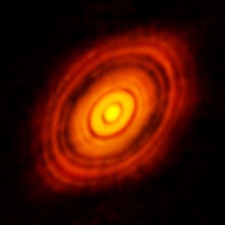 The iconic 2012 image of HL Tau revealed substructures in the disk that suggested planets form quickly after their stars. New research suggests the disk is not unusual and that early planet formation may be common.