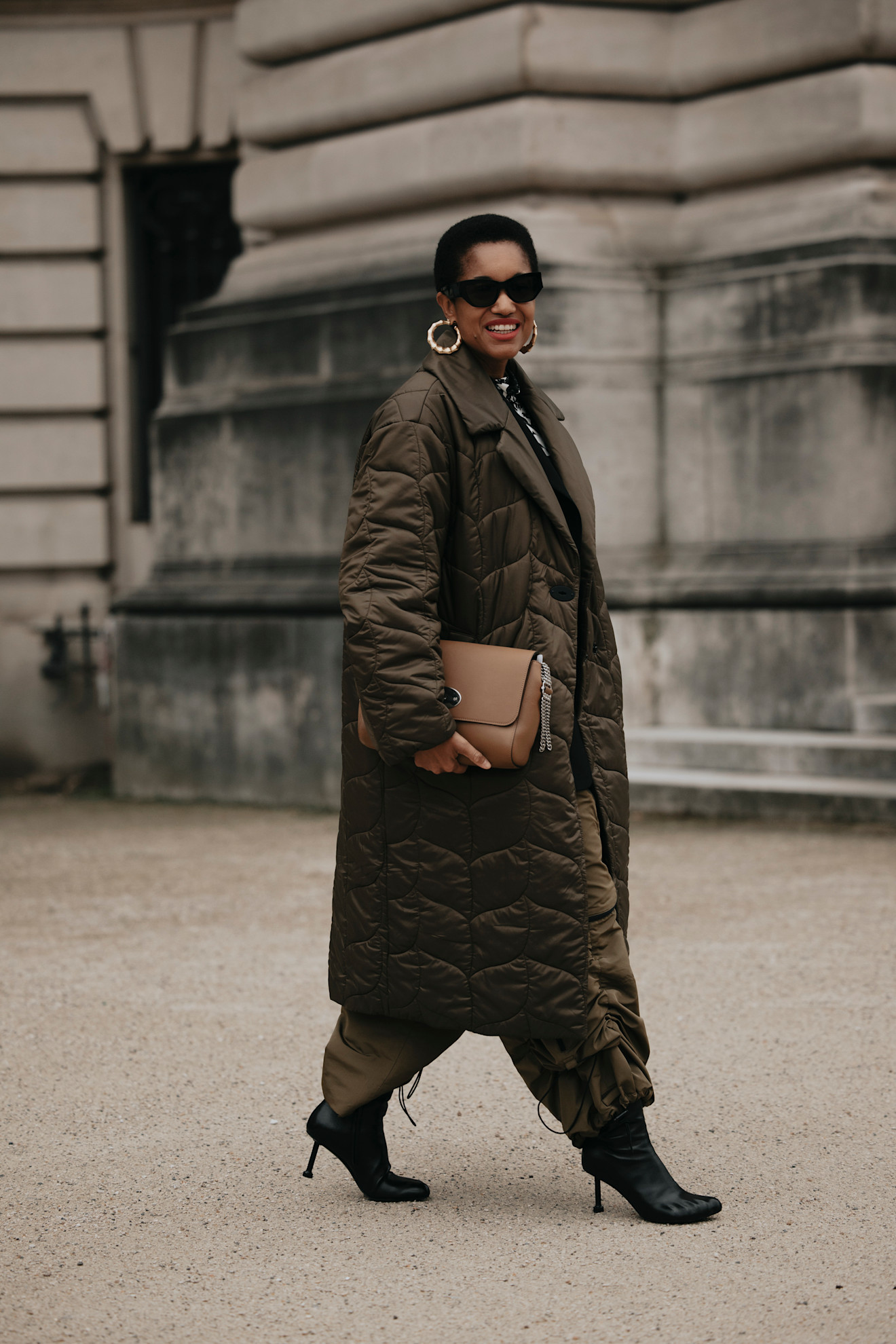A woman at fashion wearing a puffer jacket outfit