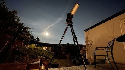 Unistellar eVscope 2 in a garden at night