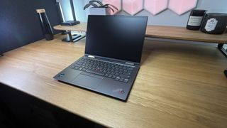 Lenovo ThinkPad X1 Yoga Gen 8 on a desk in a studio
