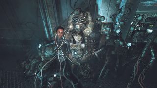 Best adventure games — In Soma, an NPC sits enmeshed in a cluster of barnacle-like technorganic material.