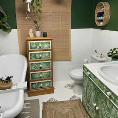bathroom after makeover with plant theme designed in green white colour