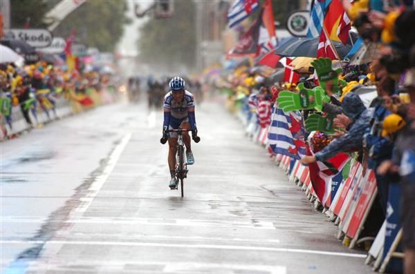 The spent figure of Sylvain Chavanel (Quick Step) crosses in fourth as the peloton charges behind him