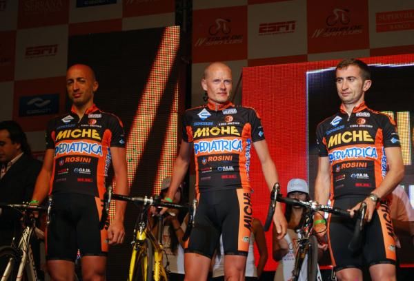 Michael Rasmussen stands alongside his Miche teammates