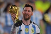 Lionel Messi of Argentina celebrates with the FIFA World Cup trophy during celebrations after an international friendly match between Argentina and Panama at Estadio M&aacute;s Monumental Antonio Vespucio Liberti on March 23, 2023 in Buenos Aires, Argentina.