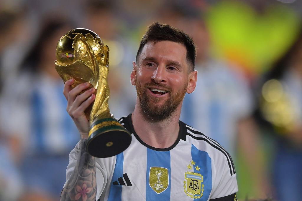 Lionel Messi of Argentina celebrates with the FIFA World Cup trophy during celebrations after an international friendly match between Argentina and Panama at Estadio Más Monumental Antonio Vespucio Liberti on March 23, 2023 in Buenos Aires, Argentina.