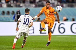 Jurrien Timber of the Netherlands battles for the ball with Christian Pulisic of USA during the Round of 16 - FIFA World Cup Qatar 2022 match between Netherlands and USA at the Khalifa International Stadium on December 3, 2022 in Doha, Qatar