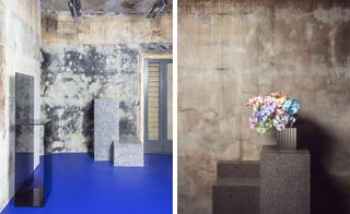 Stone and glass podiums against concrete walls