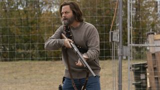 Nick Offerman as Bill, holding a shotgun, in The Last of Us episode 3