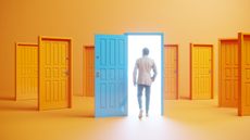 A man walks through an open door among several closed doors.