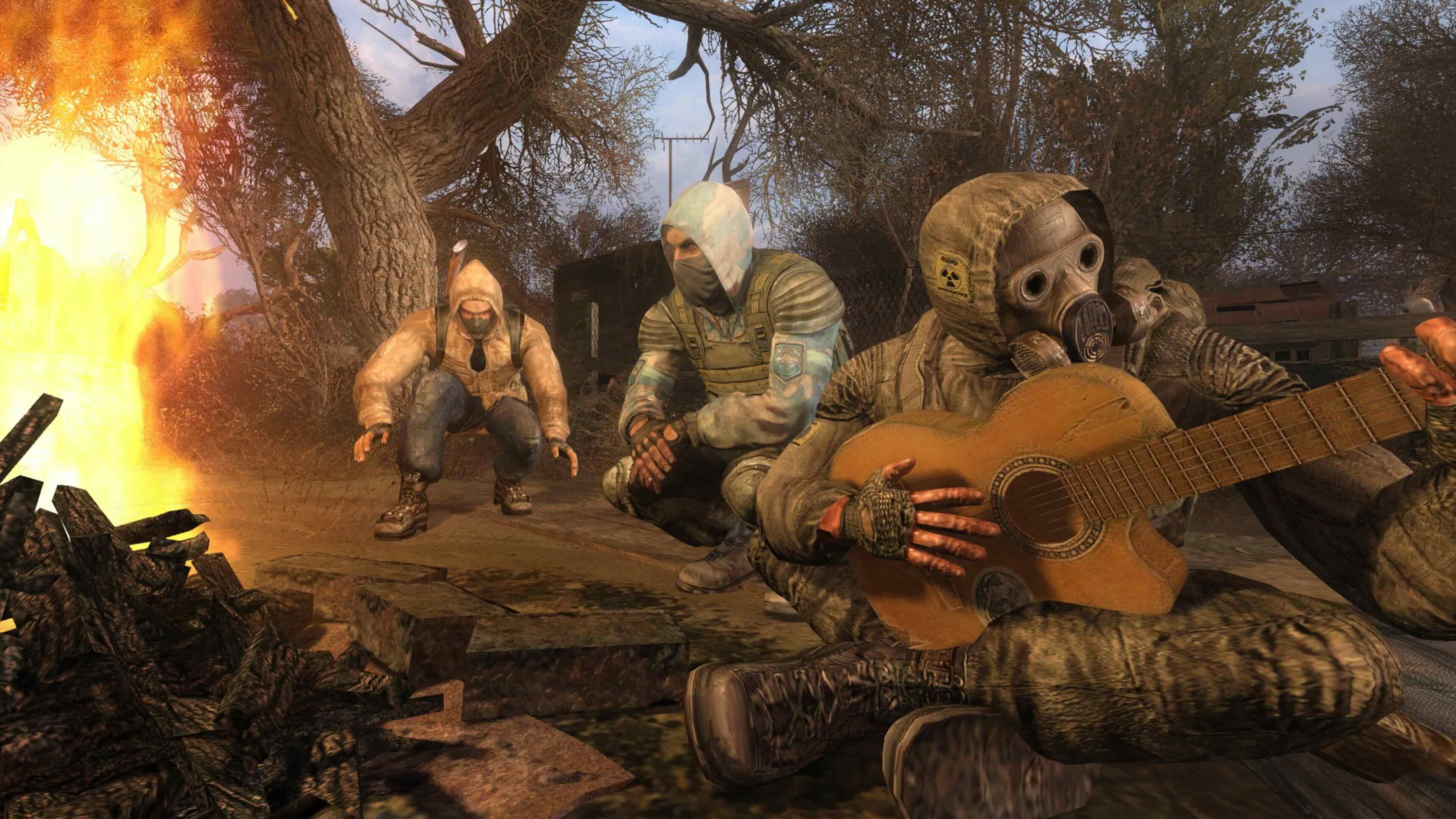 Stalkers sit around a campfire, one playing guitar.