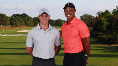 Rory McIlroy and Tiger Woods pose for a photo