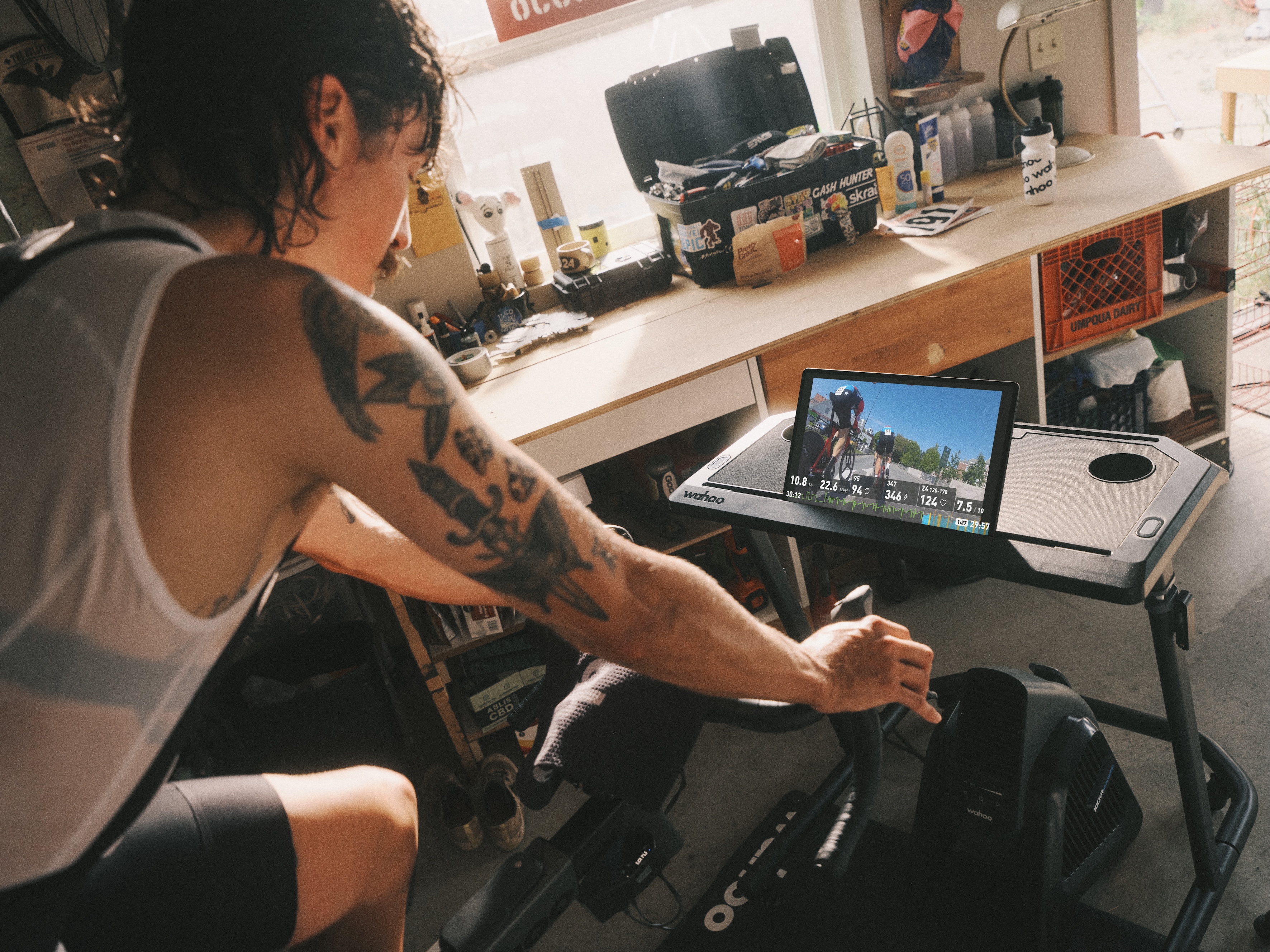 A rider using Wahoo SYSTM on an indoor trainer