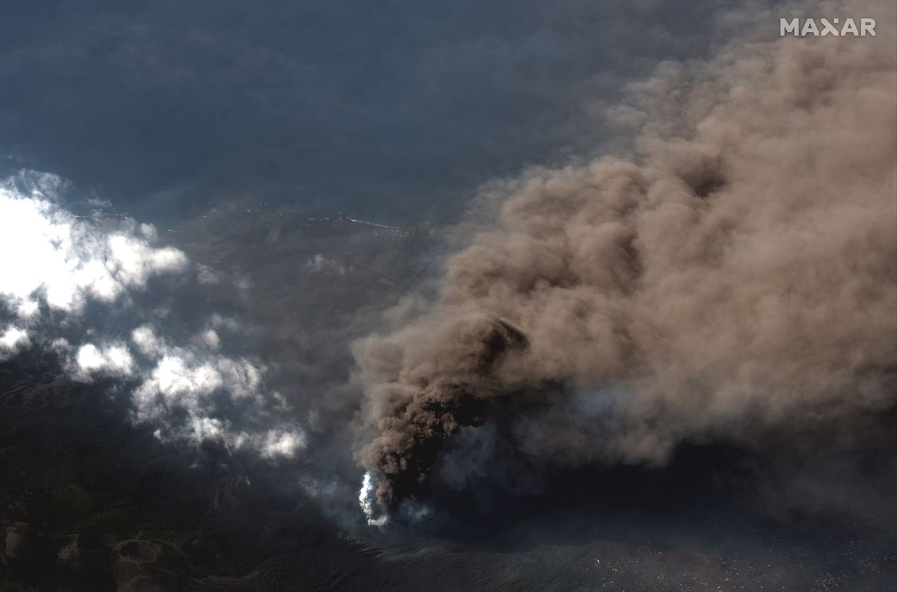 New photos of the Cumbre Vieja volcano on Spain's La Palma island taken on Oct. 14, 2021 show bright lava rivers from the continuing eruption.