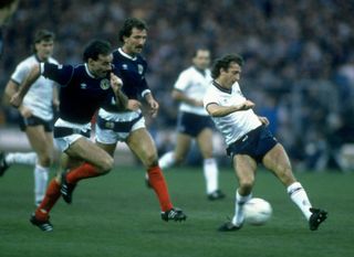 Willie Miller and Graham Souness of Scotland chase England's Trevor Francis in a match at Wembley in 1986.