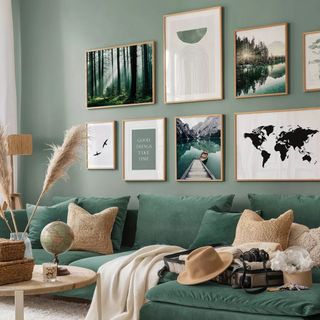Inspirational adventure gallery wall idea in green living room.
